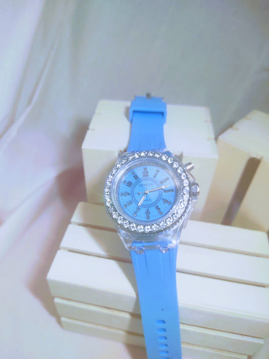 Simple Geneva blue dial, blue band Quartz that on a push of one of the side buttons it changes colors..fun watch !!!