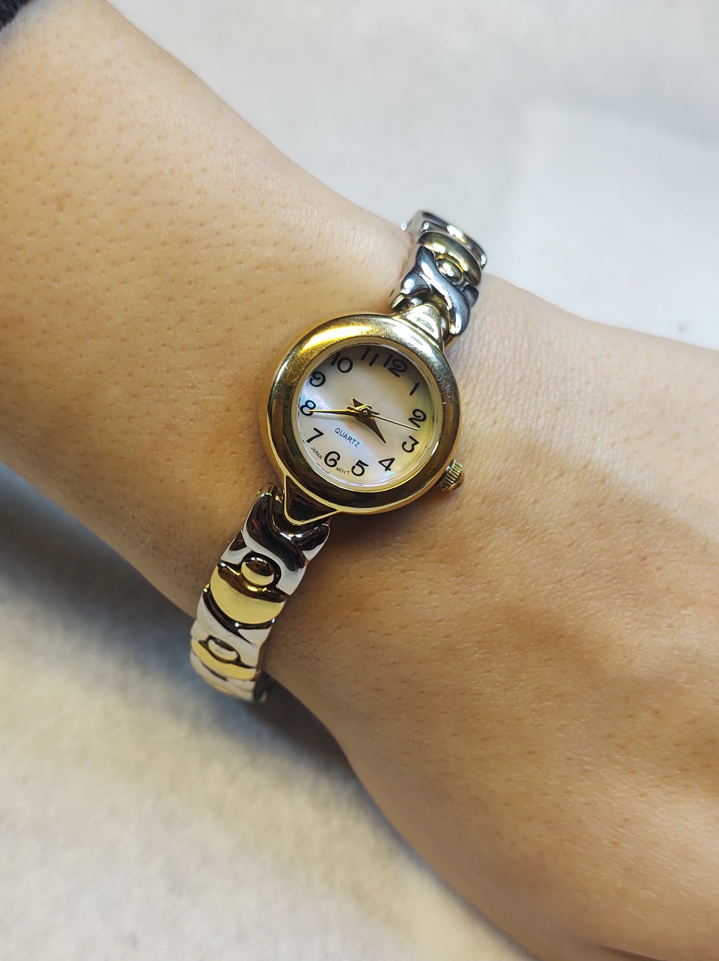Two tone silver and gold ladies quartz dress watch white dial...
